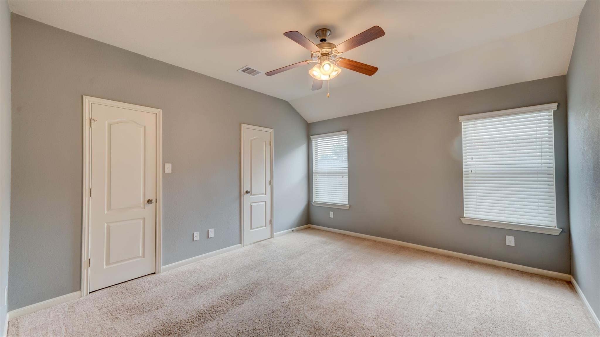 2831 Lockeridge Bend Drive Spring, TX 77386 - Photo 12 of 16 an empty room with windows and fan