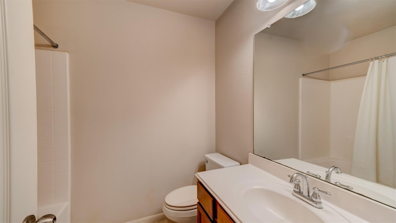2831 Lockeridge Bend Drive Spring, TX 77386 - Photo 13 of 16 a bathroom with a sink a toilet and shower