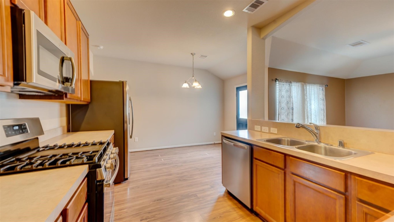 2831 Lockeridge Bend Drive Spring, TX 77386 - Photo 8 of 16 a kitchen with a sink and a stove top oven
