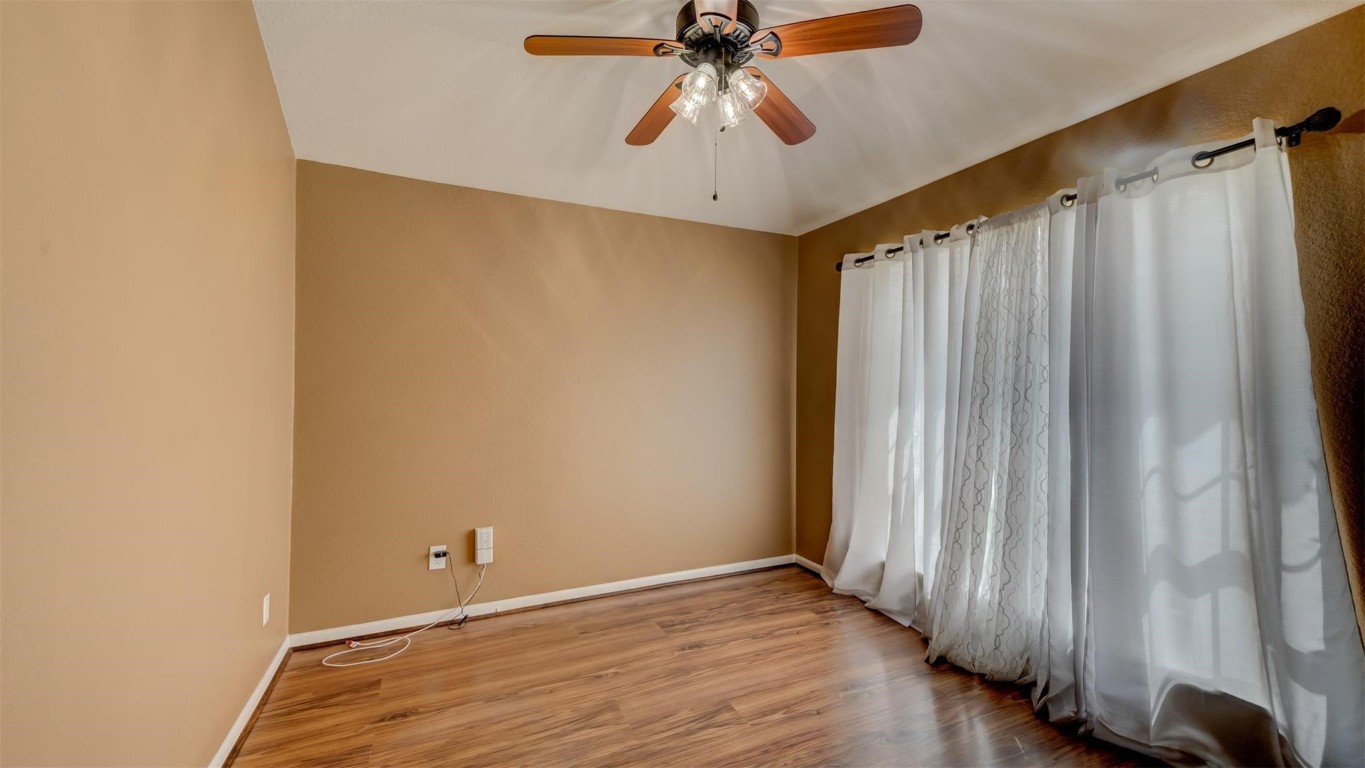 2831 Lockeridge Bend Drive Spring, TX 77386 - Photo 9 of 16 a view of room with hardwood floor and ceiling fan