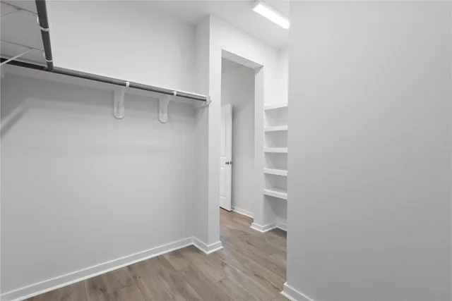 a view of an empty walk in closet