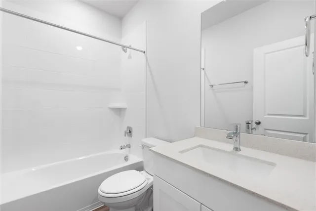 a bathroom with a sink a toilet and a bathtub