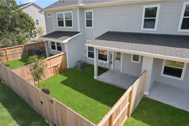 a view of an house with backyard porch and furniture