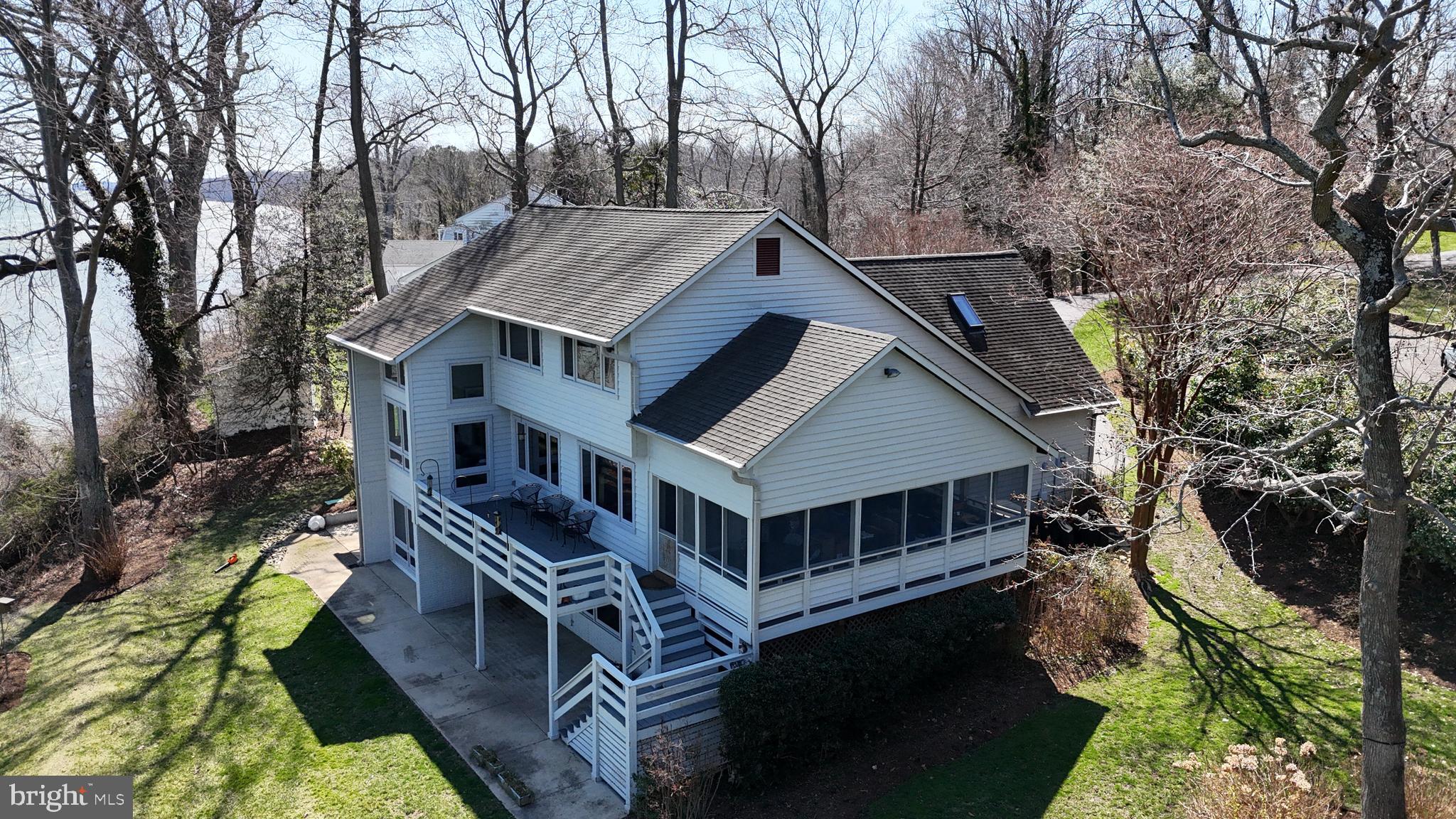 2400 Vern Road Port Republic, MD 20676 - Photo 6 of 7 a house with trees in front of it