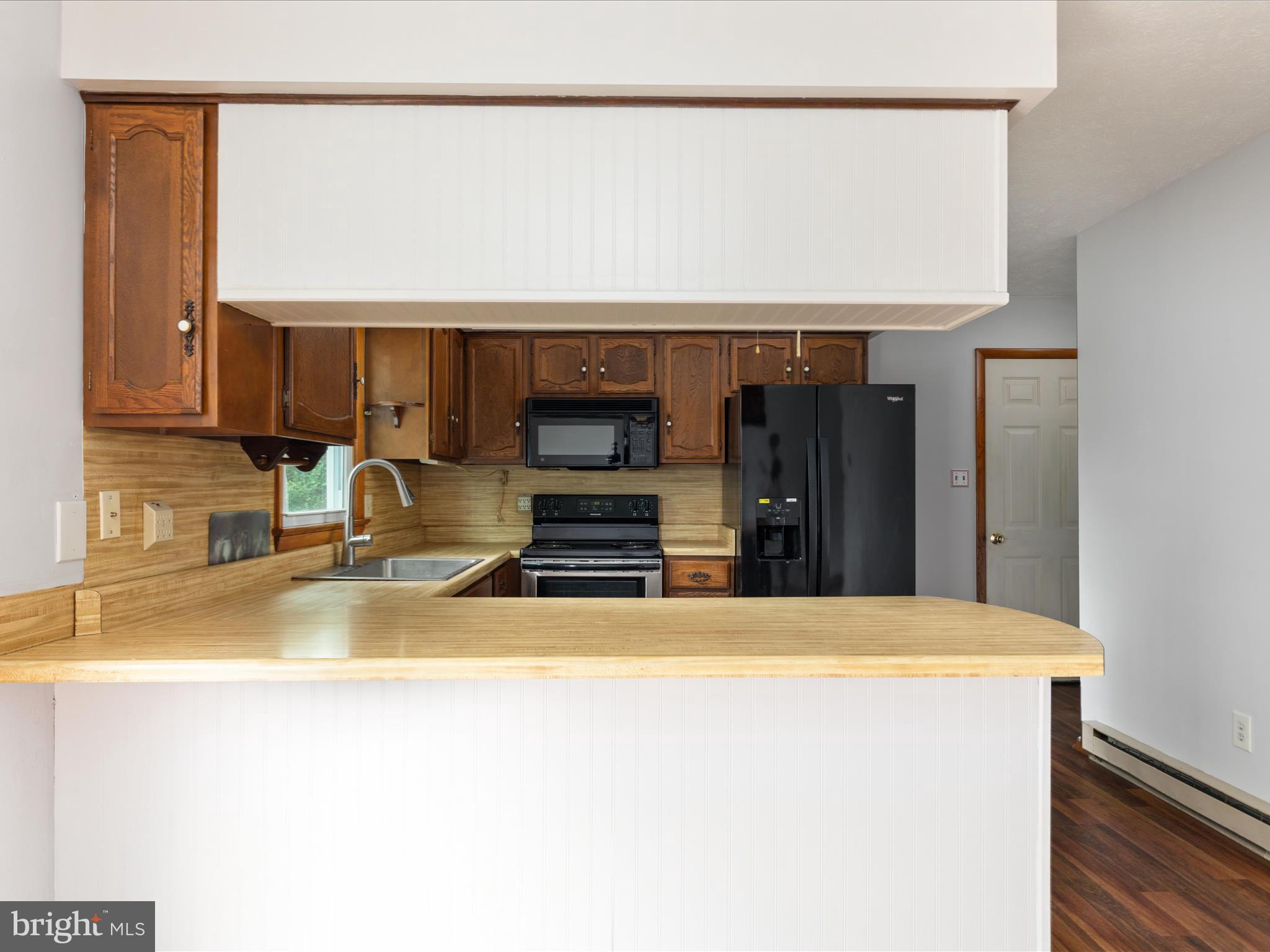 13970 Back Road Strasburg, VA 22657 - Photo 12 of 68 a kitchen with a sink a counter top space and cabinets