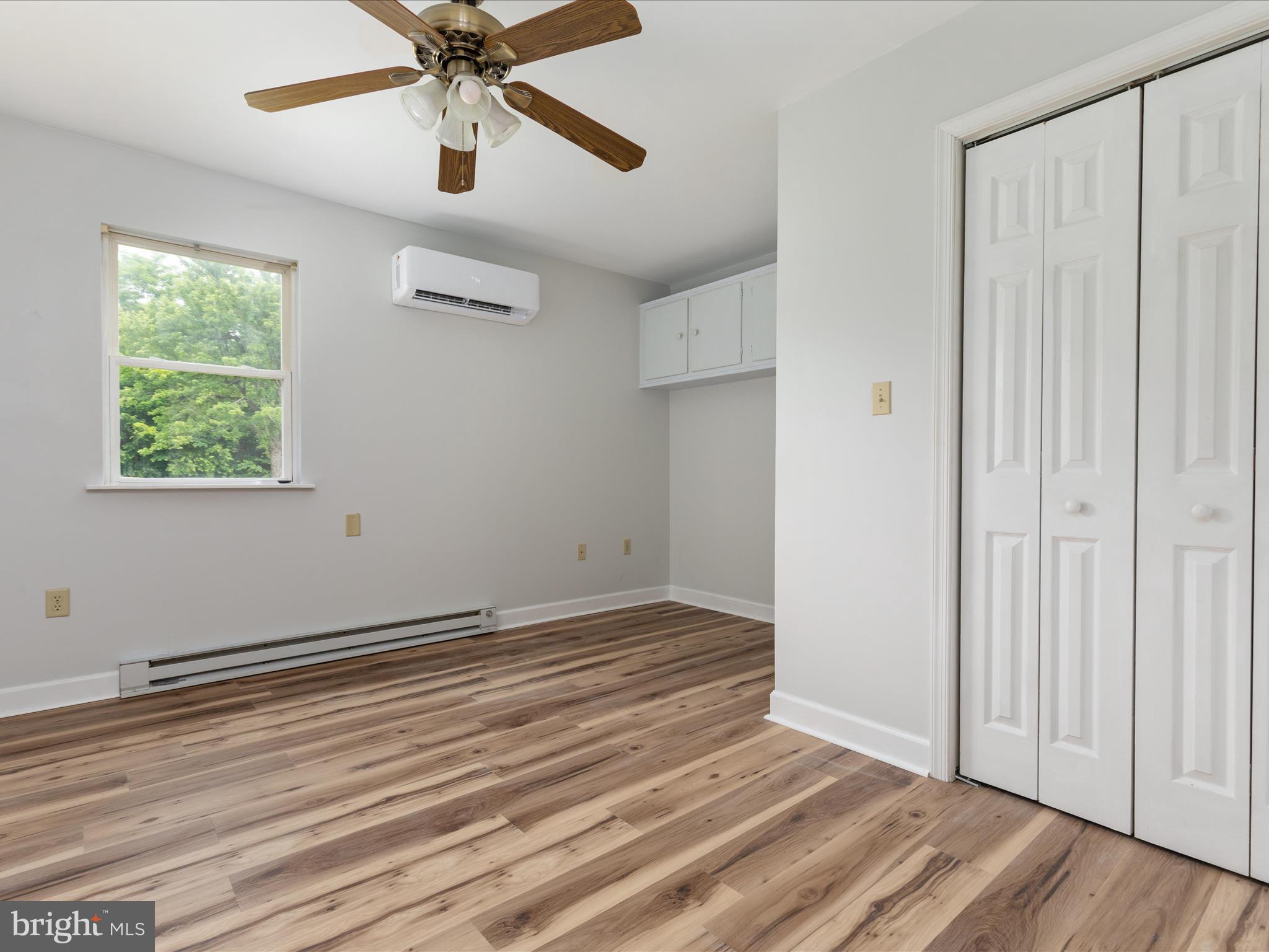 13970 Back Road Strasburg, VA 22657 - Photo 14 of 68 a view of an empty room with wooden floor and a window