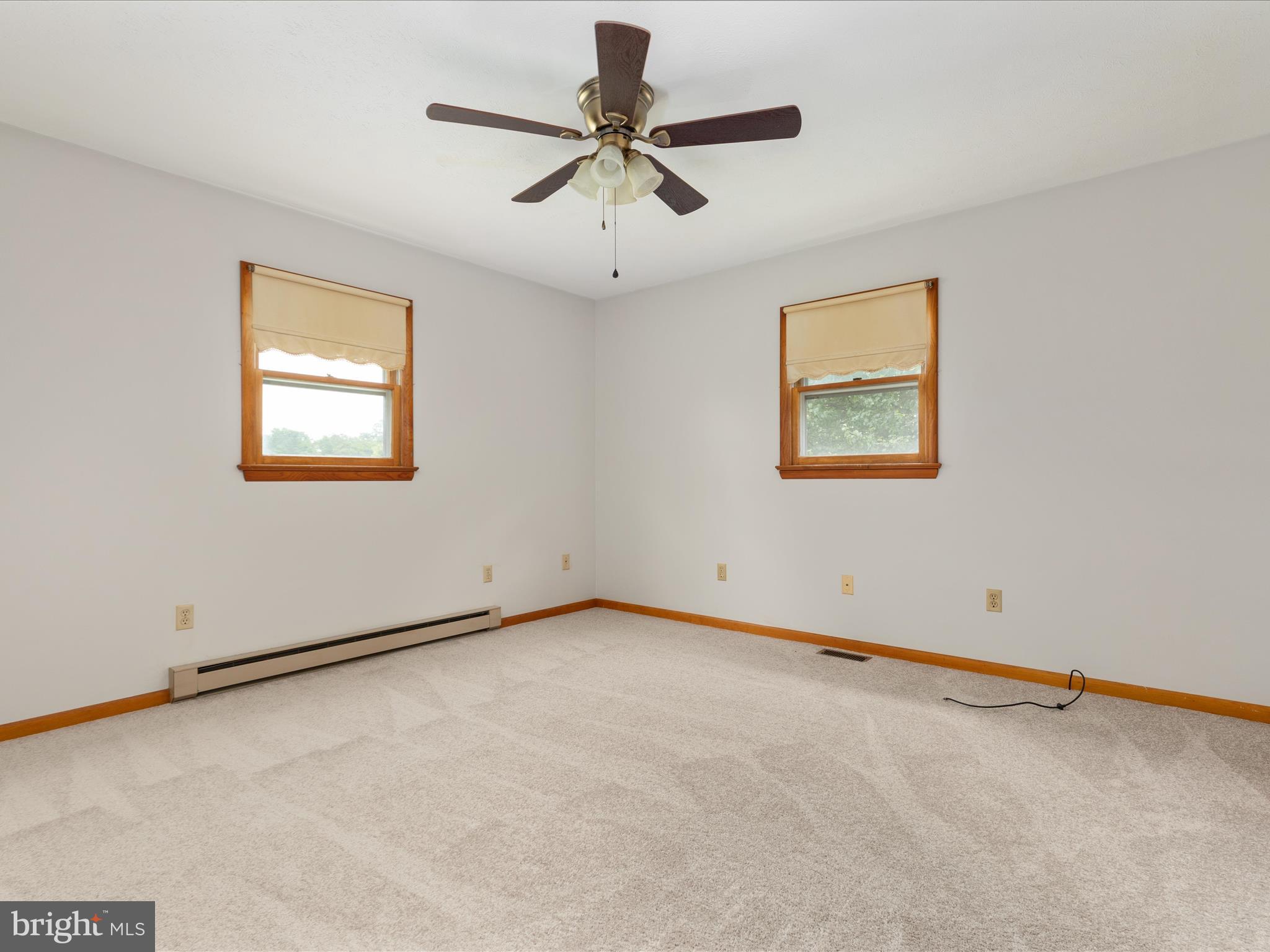 13970 Back Road Strasburg, VA 22657 - Photo 18 of 68 an empty room with a window and a ceiling fan