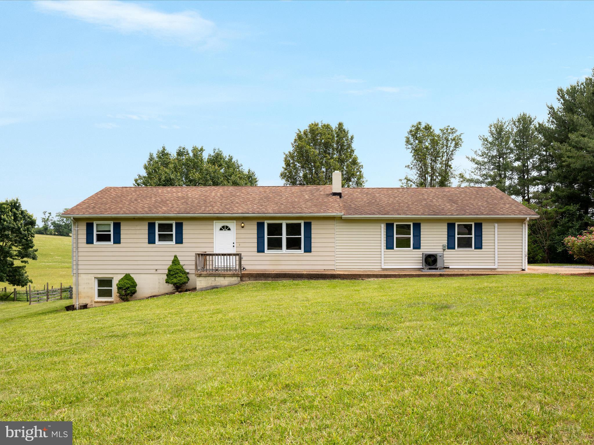 13970 Back Road Strasburg, VA 22657 - Photo 4 of 68 a front view of a house with a garden and trees