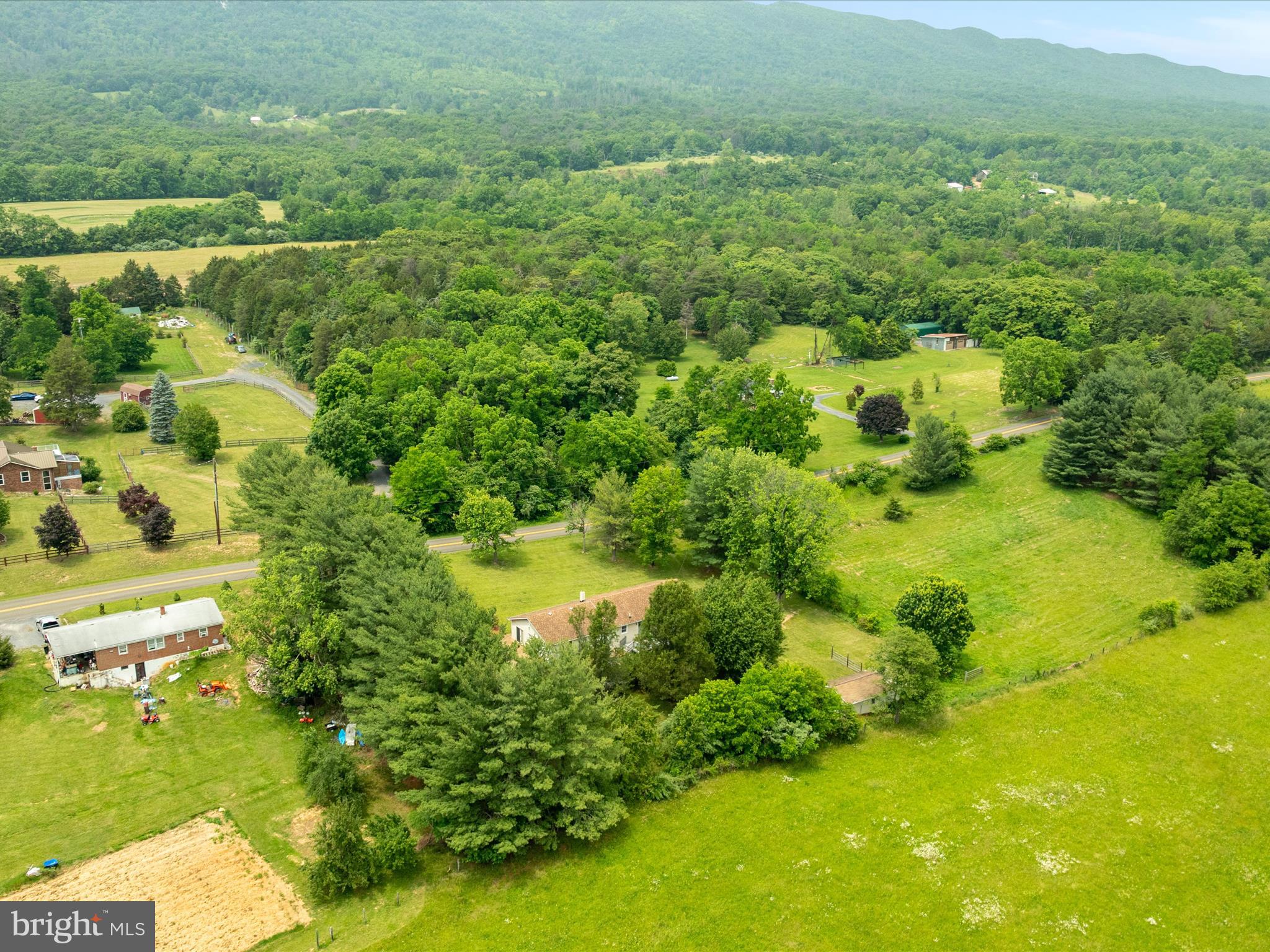 13970 Back Road Strasburg, VA 22657 - Photo 44 of 68 a view of a garden with a building in the background