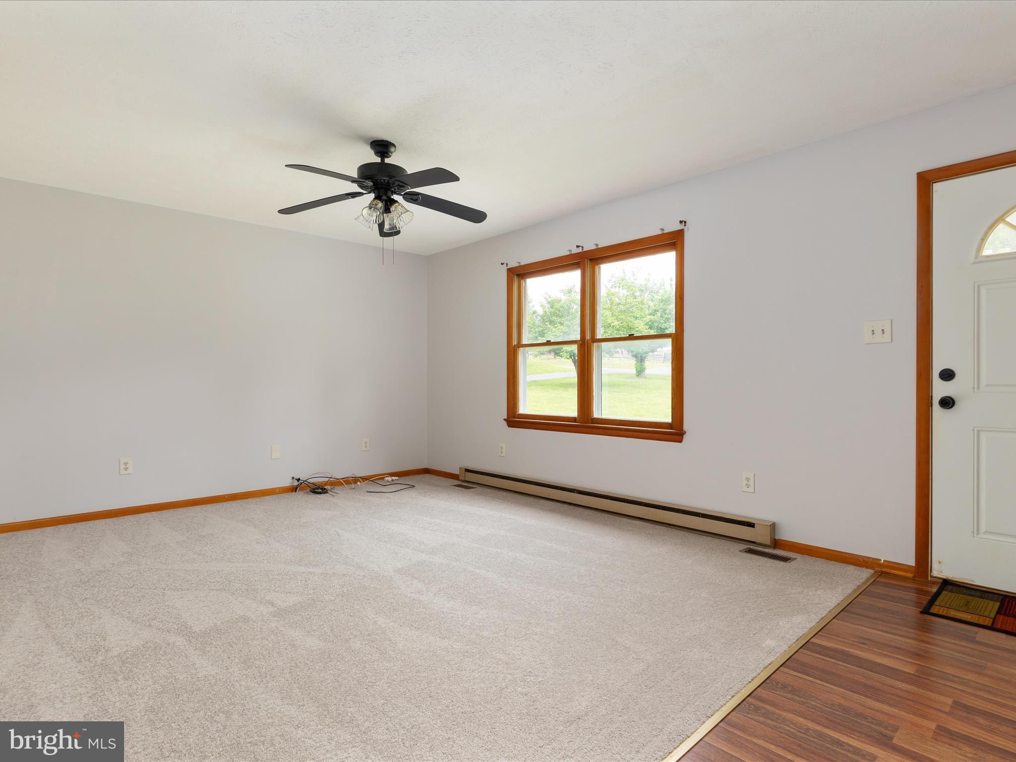 13970 Back Road Strasburg, VA 22657 - Photo 6 of 68 an empty room with windows and fan