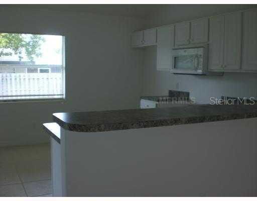 2972 Nocturne Road Venice, FL 34293 - Photo 1 of 1 Kitchen - Open floor plan. Smooth top range and 18 cu.ft. refrigerator not installed, but are included in the purchase price. This kitchen is an eat in kitchen and opens onto the lanai.
