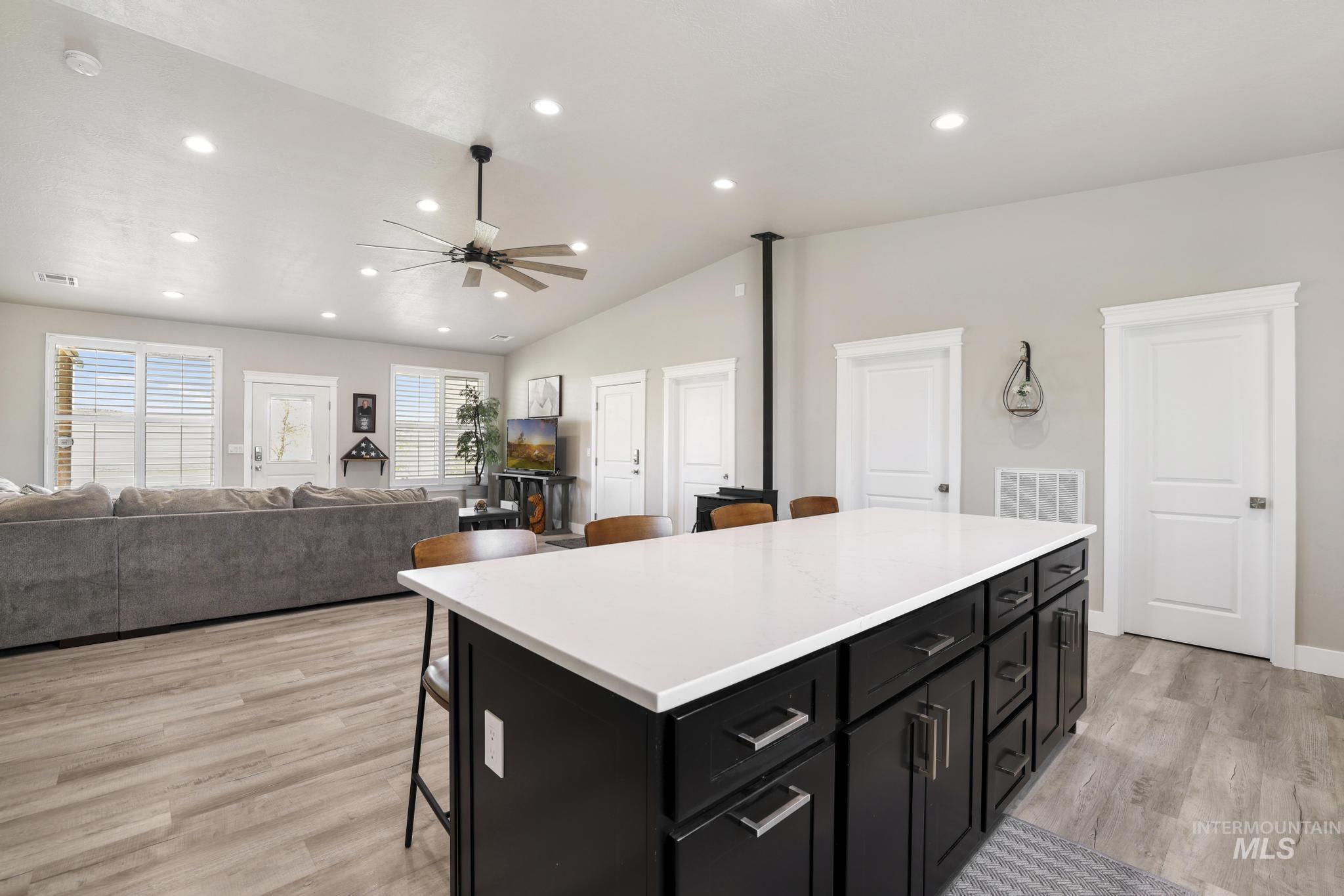 758 Cedar Crk Road Rogerson, ID 83302 - Photo 8 of 50 Kitchen island featuring a white countertop and dark cabinetry with brushed nickel hardware