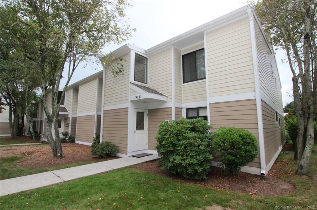 58 Olcott Way, Unit 58 Ridgefield, CT 06877 - Photo 1 of 1 a view of a house with a yard and plants