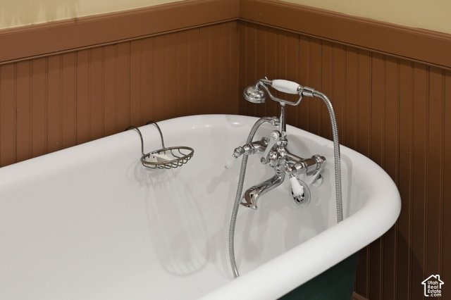 725 Canyon Road Smithfield, UT 84335 - Photo 45 of 100 White clawfoot tub with a chrome faucet and handheld shower sprayer