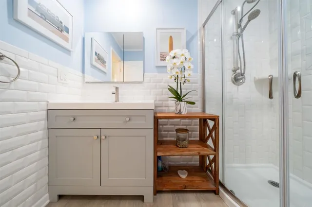 a bathroom with a sink and a mirror