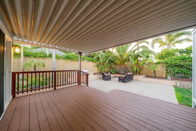 a view of outdoor space with wooden floor and outdoor seating