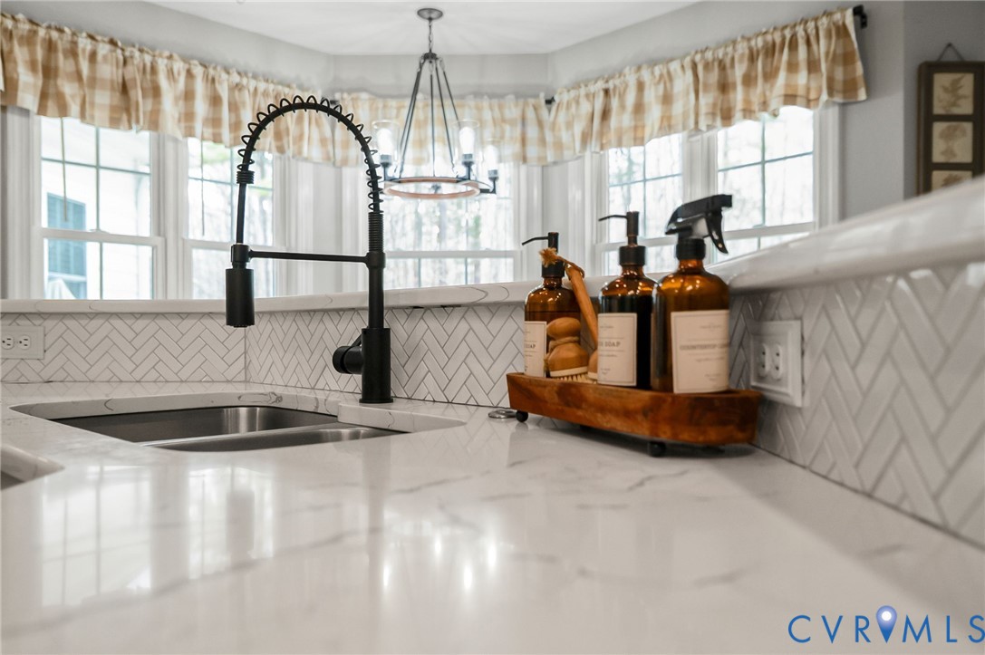 6109 Autumn Bluff Road Powhatan, VA 23139 - Photo 11 of 28 a kitchen with sink a window and couch
