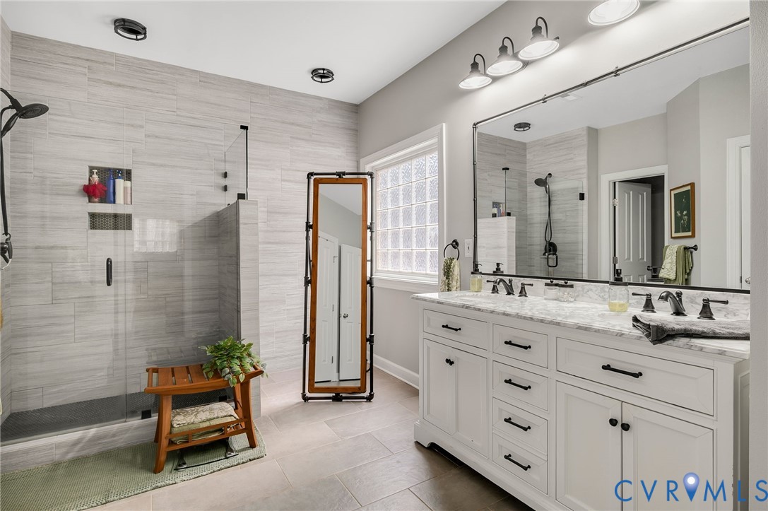 6109 Autumn Bluff Road Powhatan, VA 23139 - Photo 14 of 28 a bathroom with a double vanity sink mirror and double