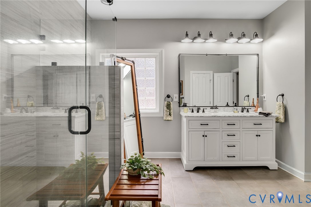 6109 Autumn Bluff Road Powhatan, VA 23139 - Photo 16 of 28 a bathroom with a granite countertop sink vanity granite and a mirror