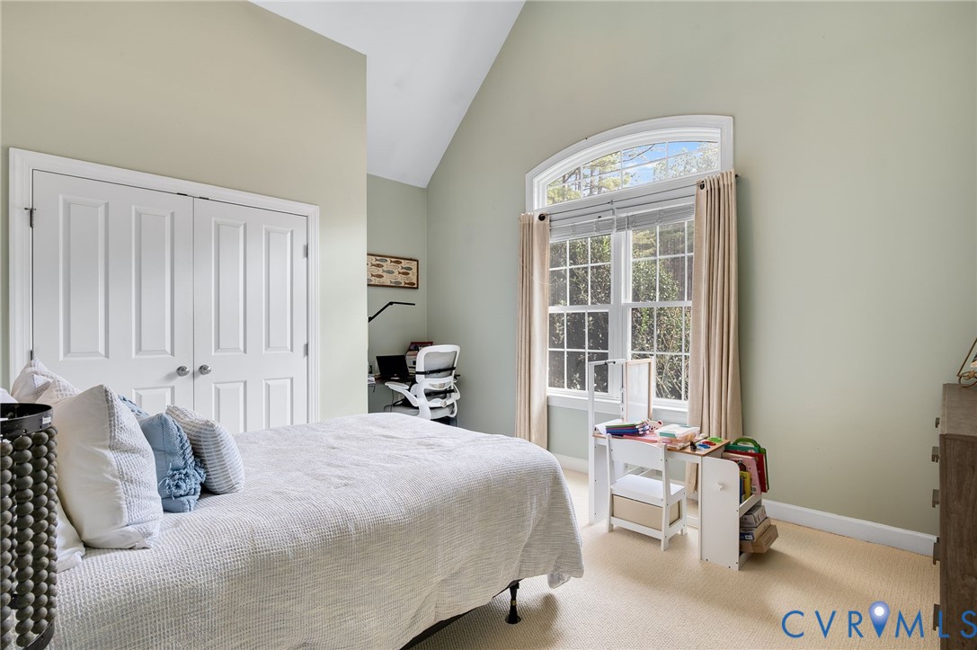 6109 Autumn Bluff Road Powhatan, VA 23139 - Photo 17 of 28 a bedroom with a bed and a large window