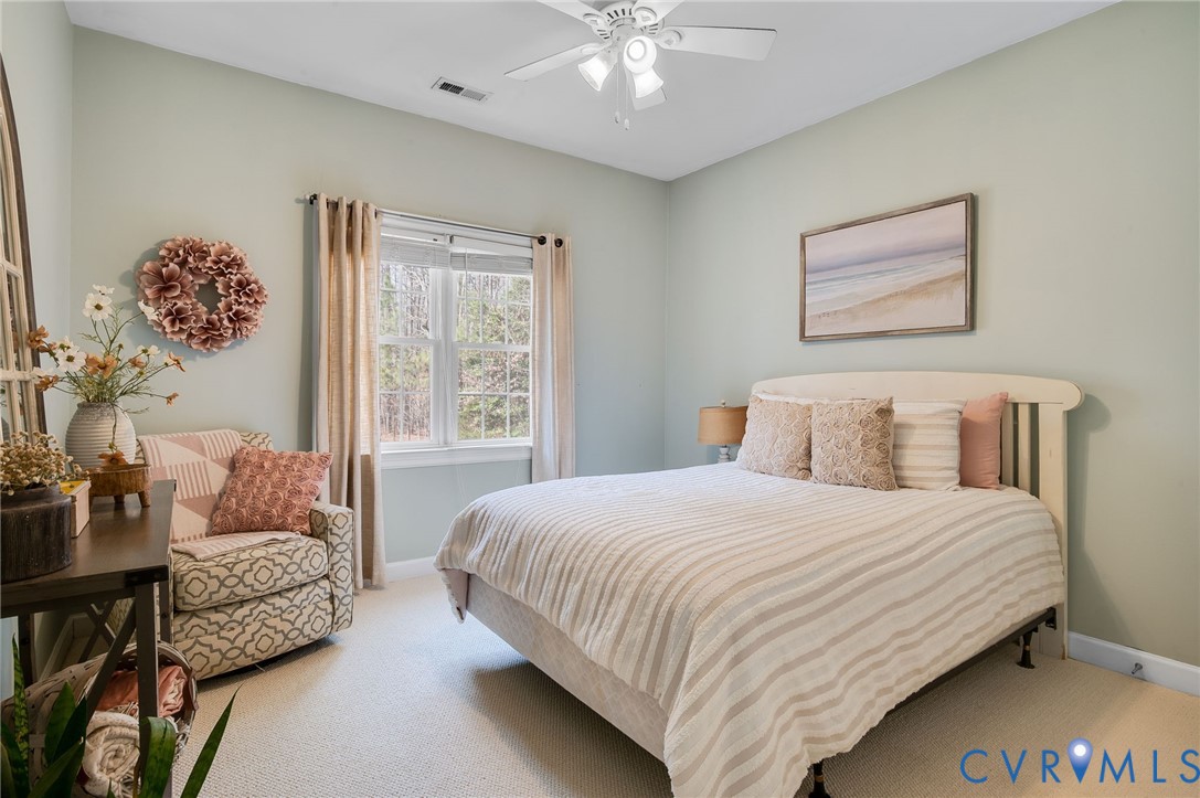 6109 Autumn Bluff Road Powhatan, VA 23139 - Photo 19 of 28 a bedroom with a bed and a couch
