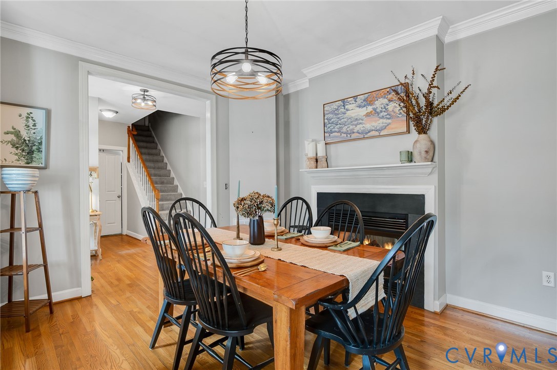 6109 Autumn Bluff Road Powhatan, VA 23139 - Photo 8 of 28 a view of a dining room with furniture wooden floor and chandelier