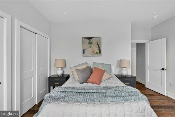 a large white bed in a white room