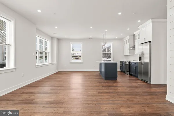 a view of kitchen with window and wooden floor