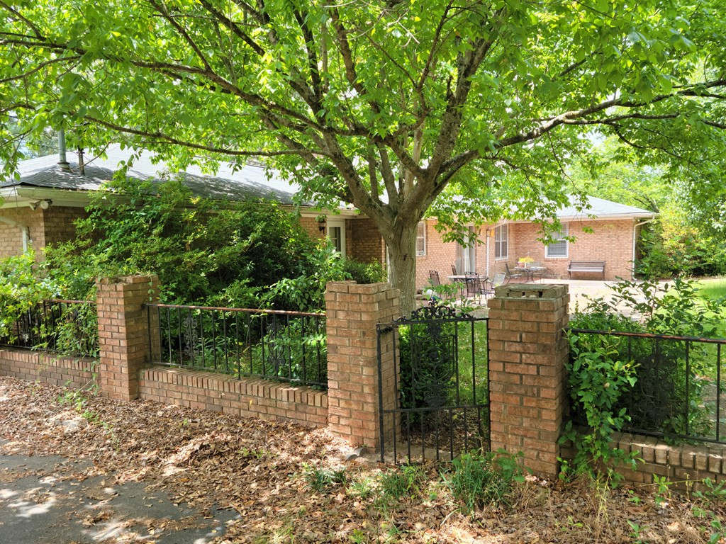 4321 Columbia Road Martinez, GA 30907 - Photo 23 of 51 Fenced in garden yard of elegant wrought iron and