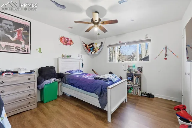 a living room with a bed and a window