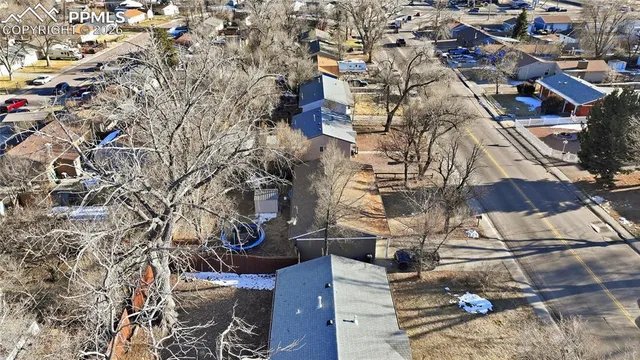 an aerial view of residential houses with outdoor space