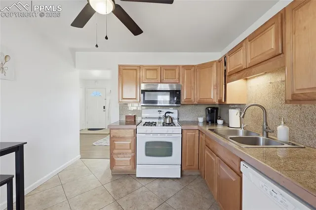 a kitchen with stainless steel appliances granite countertop a stove and a sink