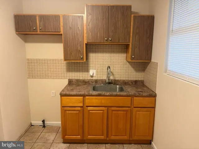 a kitchen with sink cabinets and a counter top space