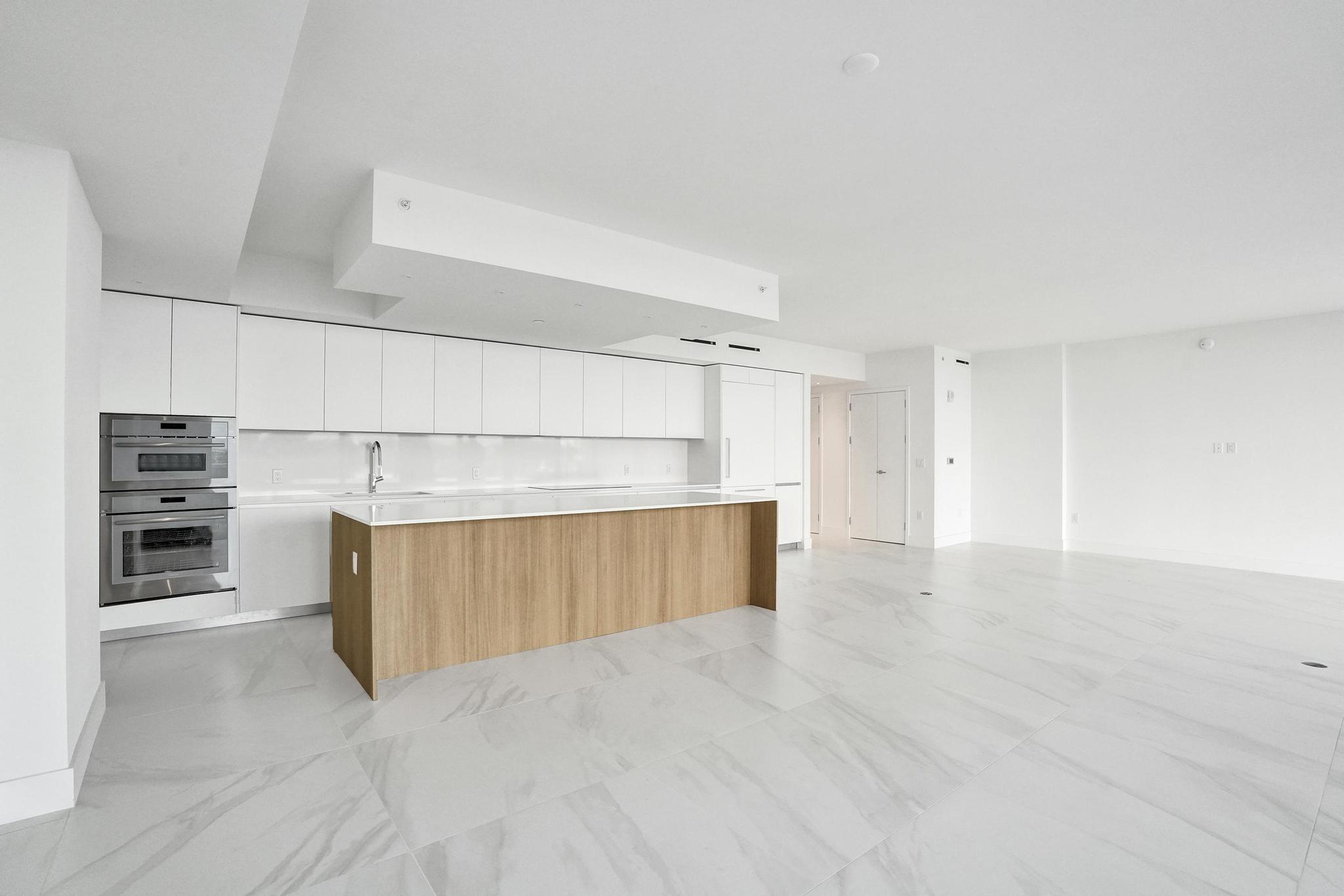 407 North Riverside Drive, Unit 303 Pompano Beach, FL 33062 - Photo 7 of 74 a view of kitchen with cabinets and oven