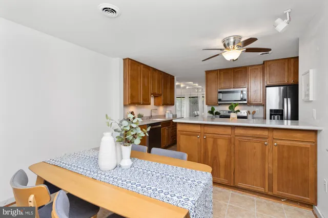 a kitchen with a table and chairs
