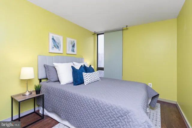 a bedroom with a bed and lamps