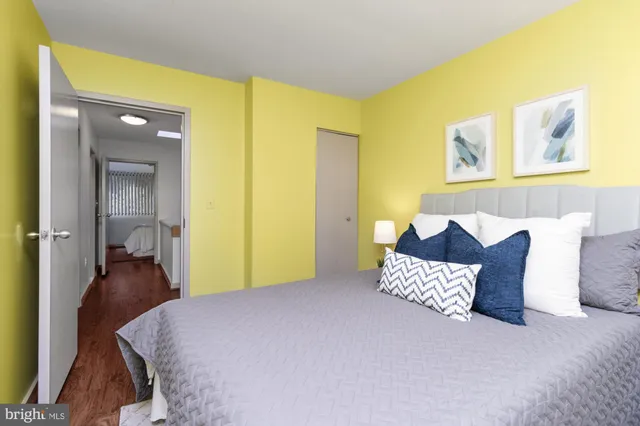 a bedroom with a bed and a couch