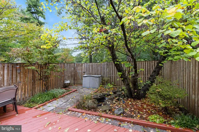 a garden with wooden fence