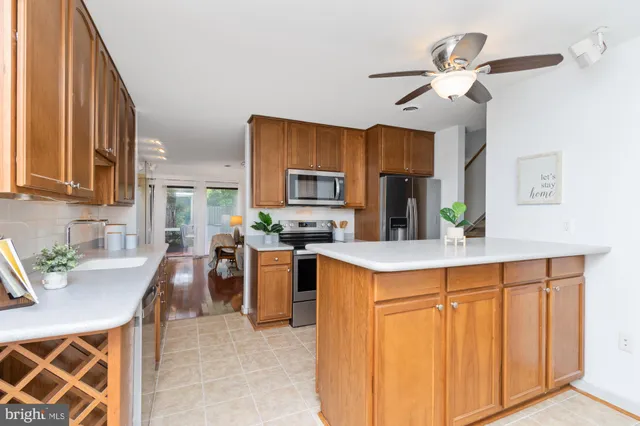 a kitchen with cabinets and window