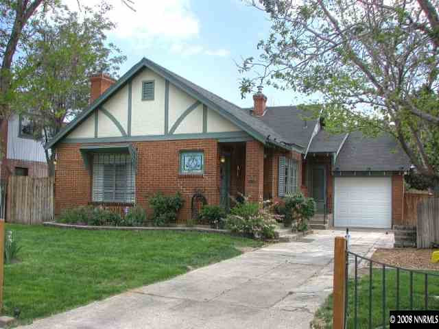 1374 Lander Street Reno, NV 89509 - Photo 1 of 9 a front view of a house with a garden and plants