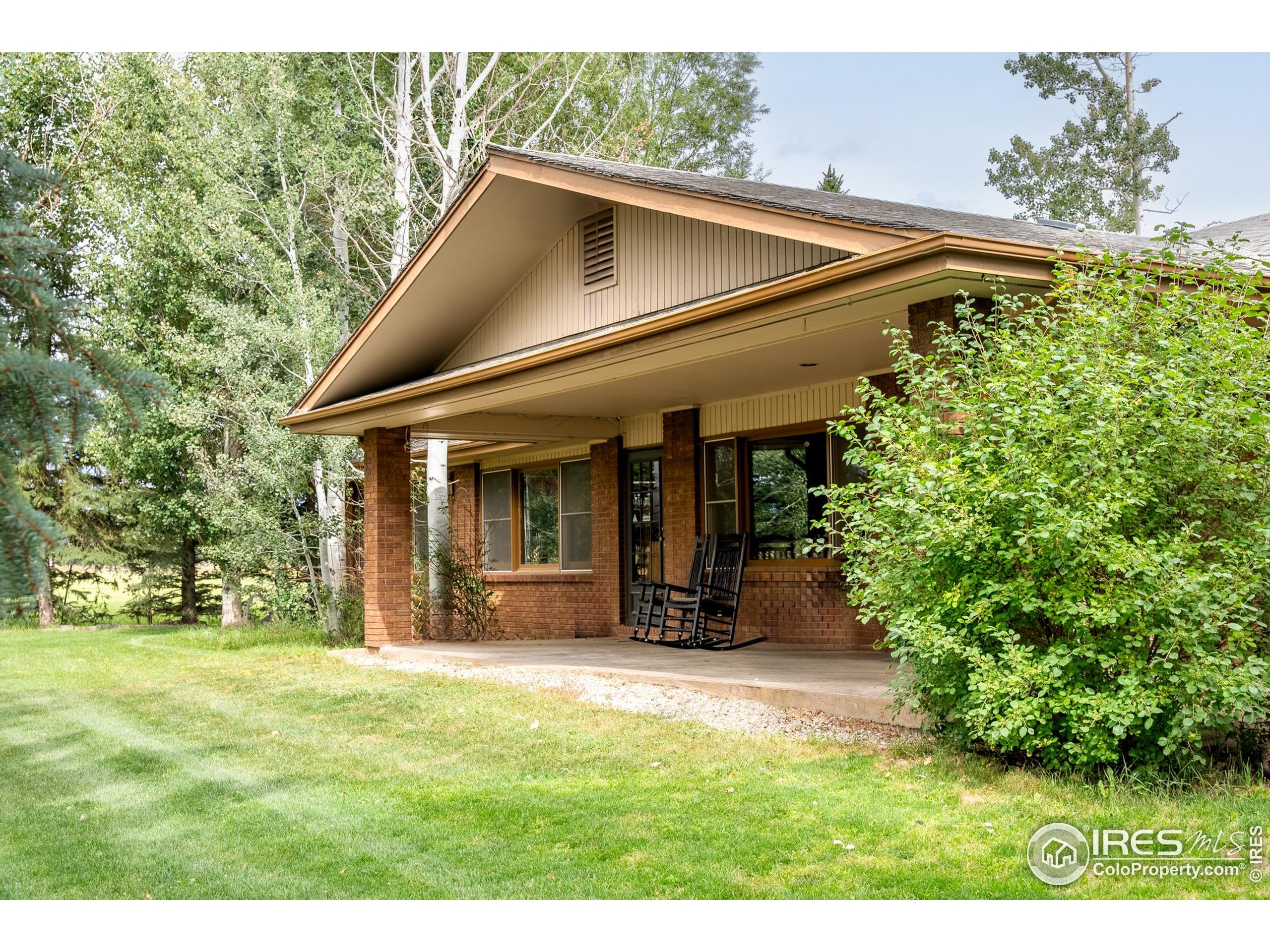 6789 Niwot Road Longmont, CO 80503 - Photo 12 of 28 a front view of a house with a yard