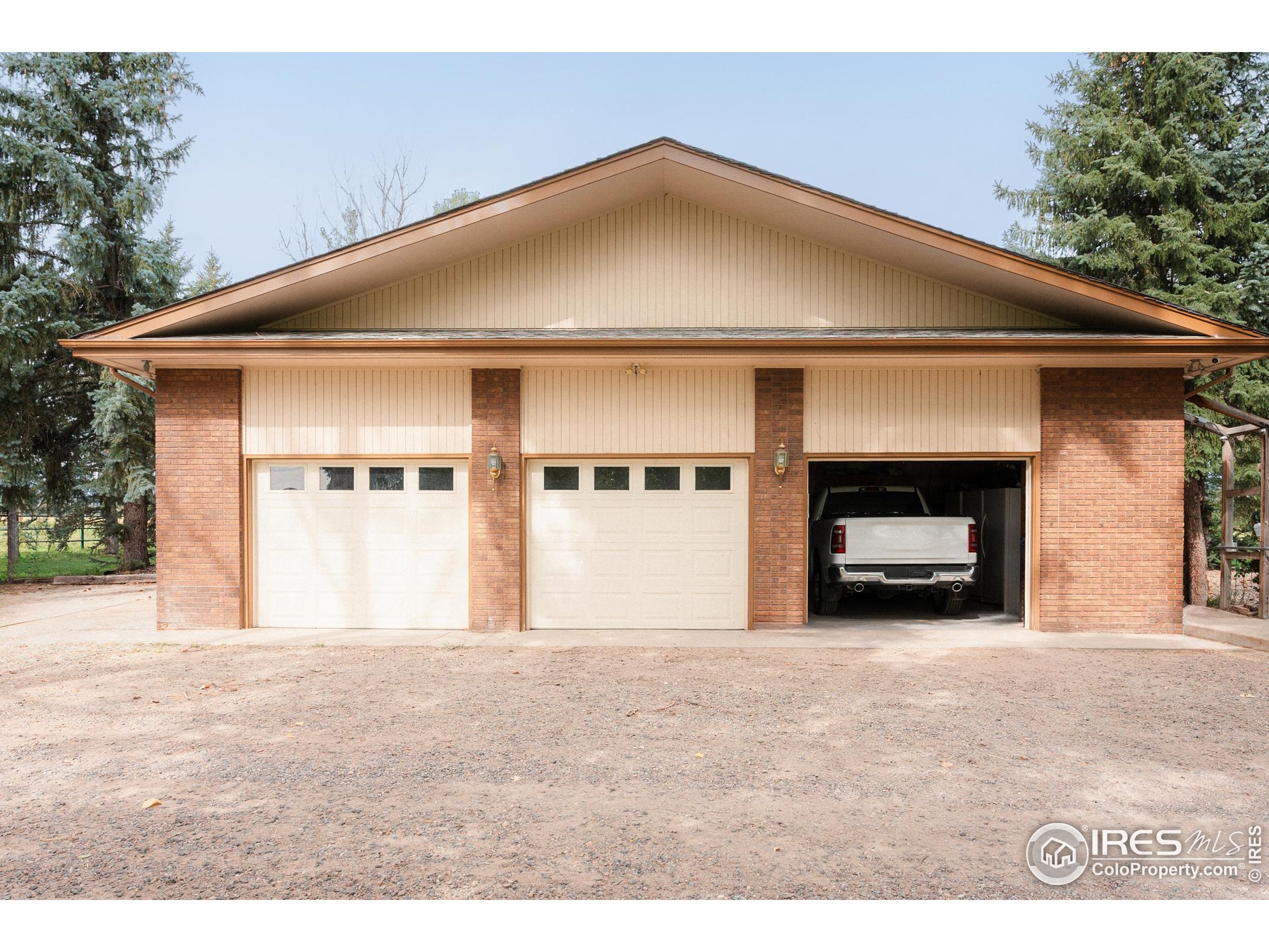 6789 Niwot Road Longmont, CO 80503 - Photo 18 of 28 a front view of a house with a yard and garage