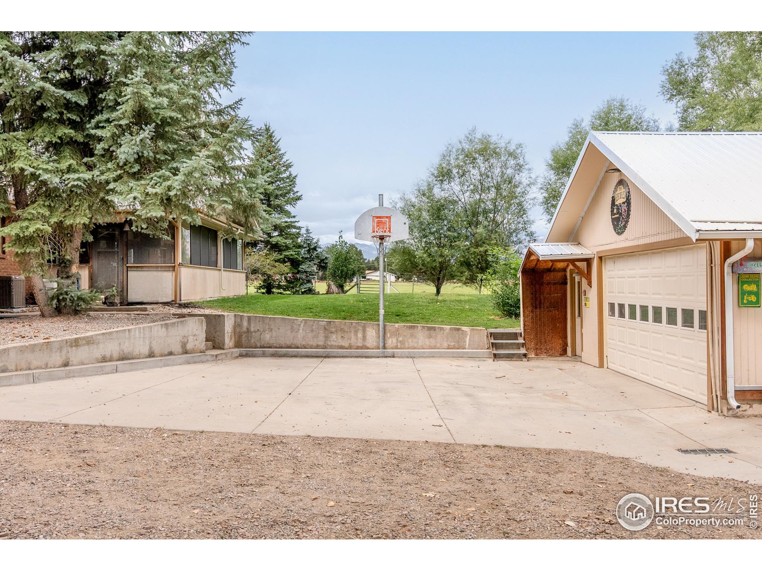 6789 Niwot Road Longmont, CO 80503 - Photo 19 of 28 a view of a house with a yard and potted plants