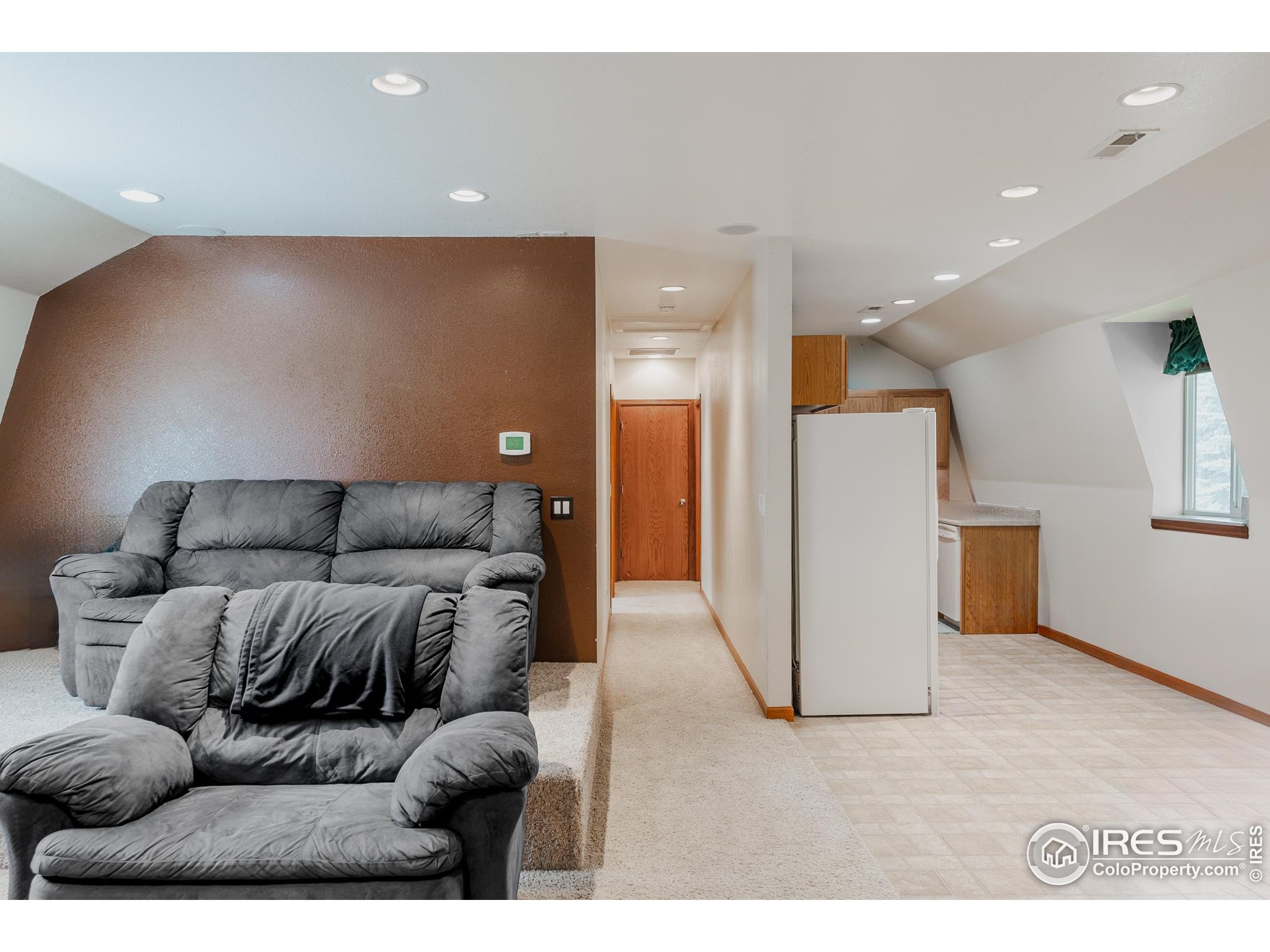6789 Niwot Road Longmont, CO 80503 - Photo 21 of 28 a living room with furniture and a couch