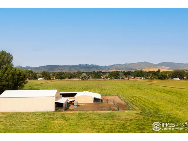 a aerial view of a house with a yard