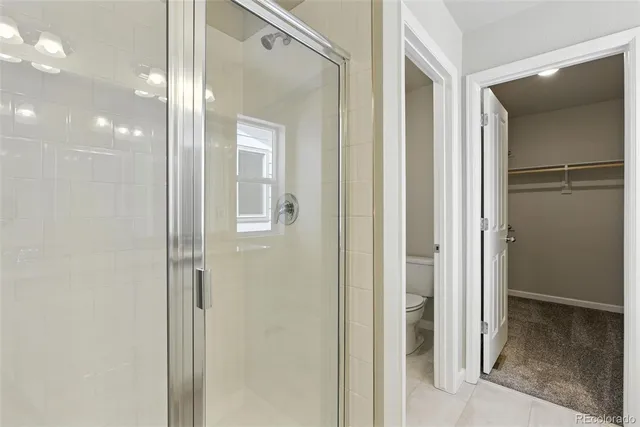 a view of a bathroom from a hallway