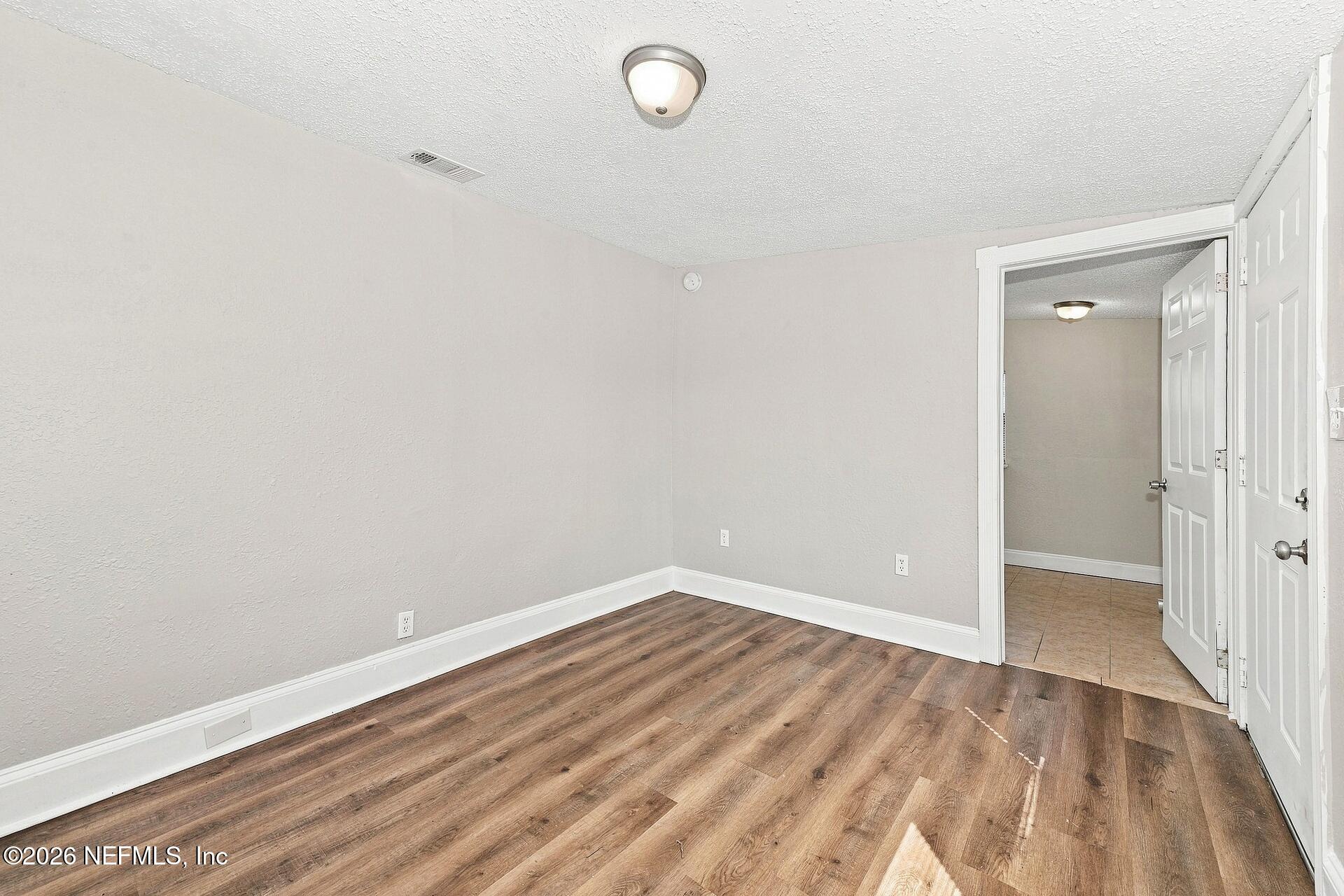 9776 Hogan Road Jacksonville, FL 32246 - Photo 10 of 16 010 - Primary Bedroom