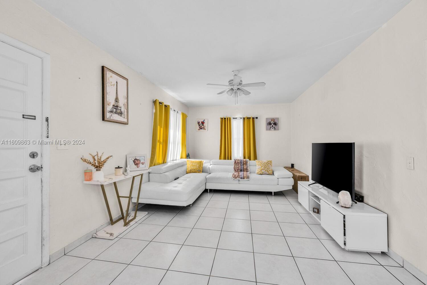 3430 Southwest 11th Street Miami, FL 33135 - Photo 11 of 21 a living room with furniture and flat screen tv