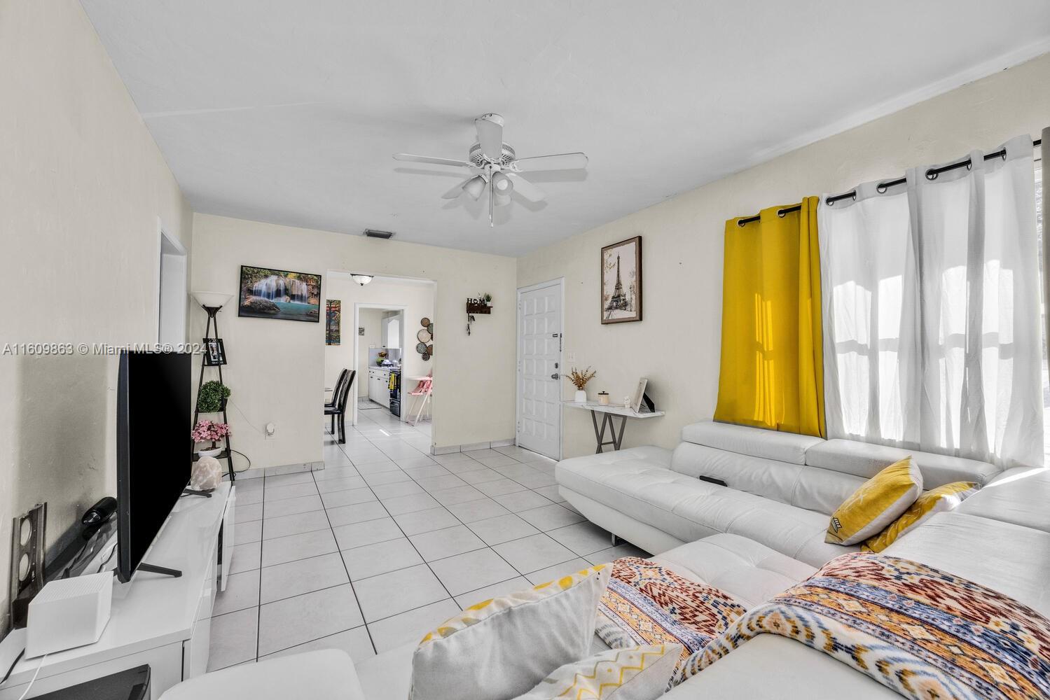 3430 Southwest 11th Street Miami, FL 33135 - Photo 12 of 21 a bedroom with a bed and a flat screen tv