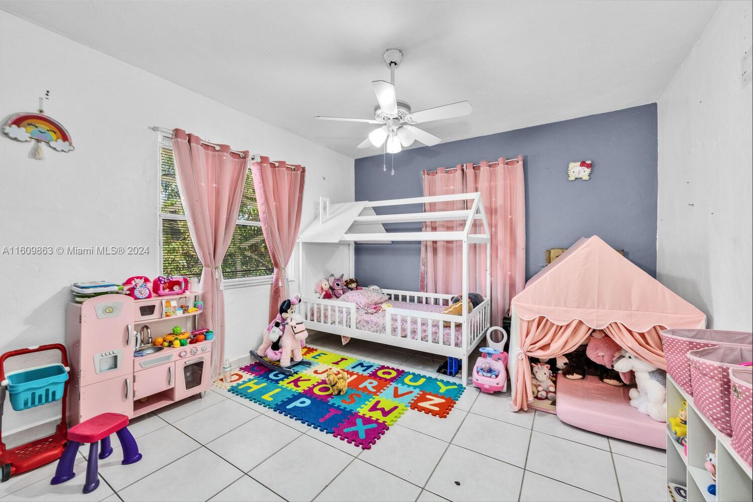 3430 Southwest 11th Street Miami, FL 33135 - Photo 18 of 21 a bedroom with baby toys and wooden floor